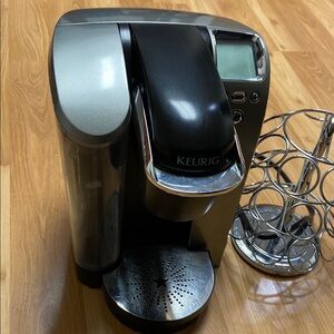 Keurig Black and Silver Coffee Maker with pod holder